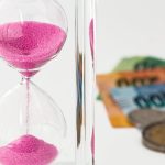 Hourglass, money, time — Accelerate Your Riverside Home Sale: Tips from Real Estate Experts
